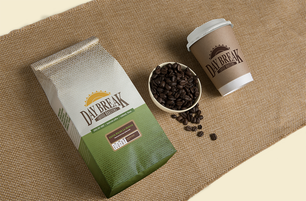 Day Break Costa Rican La Minita coffee bag, beans, and coffee cup